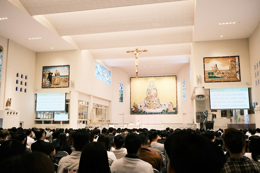 Adults attending a lecture in a bright room